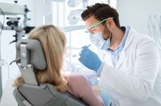 Home Services Dentist examining a patients mouth