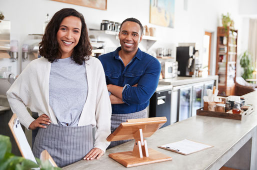 Home Services @ restaurant workers smiling at the counter