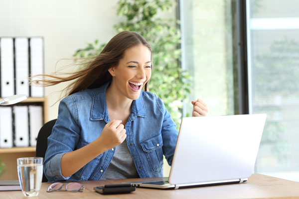 Excited Business owner looking at their website