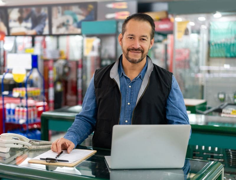 Owner of a home service business looking at a Laptop