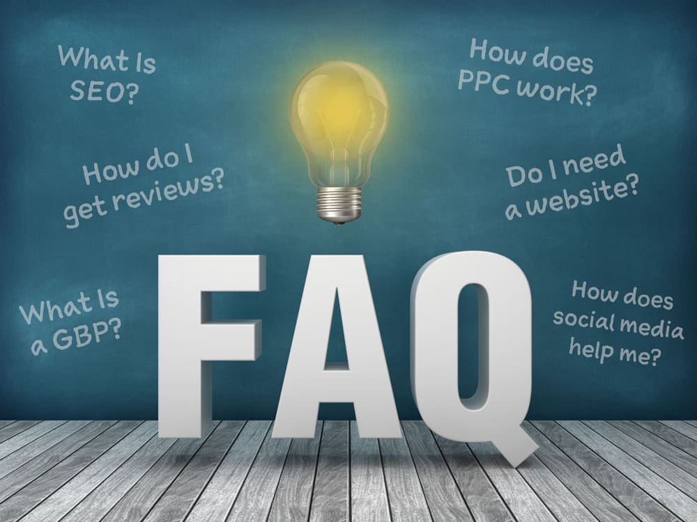 words FAQ with a lightbulb lit up above it with various questions around it about digital marketing.