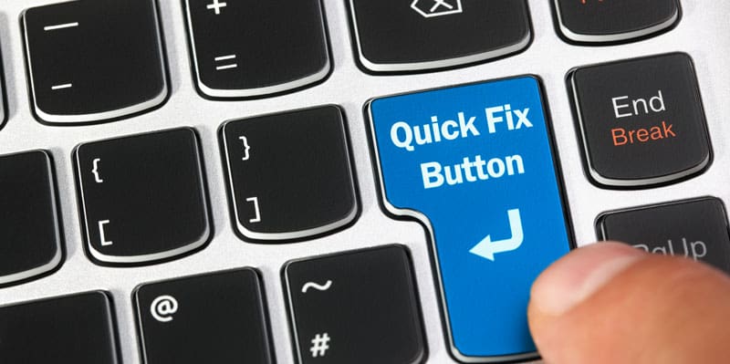 a keyboard with a finger hanging over a button that says quick fix