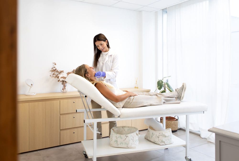 A-female-dermatologist-injecting-facial-filler A female dermatologist injecting facial filler